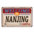 Vintage grunge Welcome to Nanjing China rusted plate on white background