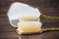 Antique hair brush reflecting in a mirror