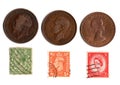 Vintage half penny stamps and coins from the United Kingdom. Royalty Free Stock Photo