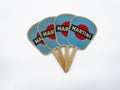 Vintage hand folding fan made of paper with Martini logo. single light brown stick made of wood