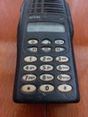 Vintage Handheld Two-Way Radio on Wooden Surface
