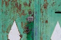 Vintage handle on the door. The old iron door. Metal gate. Cracked paint. Royalty Free Stock Photo