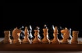 Vintage handmade wooden chess board and figures Royalty Free Stock Photo