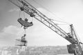 Vintage handyman having lunch on a crossbar hanging above the ci