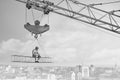 Vintage handyman having lunch on a crossbar hanging above the ci Royalty Free Stock Photo