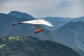 Vintage hang glider flies in the mountains Royalty Free Stock Photo
