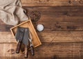 Vintage hatchets for meat in wooden box with salt and pepper on wooden table background with linen towel and fork. Top view