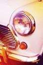Vintage headlight white car Royalty Free Stock Photo