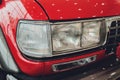 vintage headlights on square body truck close-up.