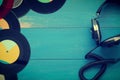 Vintage headphones with old vinyl records Royalty Free Stock Photo