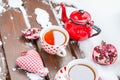 Vintage Heart, Hot Cup of Tea on the Snow, Red Teapot Royalty Free Stock Photo