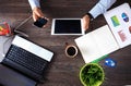 Vintage hipster wooden desktop top view, male hands using laptop Royalty Free Stock Photo