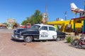 Vintage historic police car at a shop and a route 66 souvenir shop in Seligman, USA