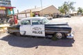 Vintage historic police car at a shop and a route 66 souvenir shop in Seligman, USA