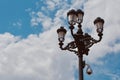 Vintage historical street lamp against moody skyline at daytime downtown Madrid, Spain