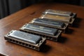 Vintage Hohner Harmonica Set on Wooden Table Royalty Free Stock Photo
