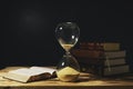 Vintage hourglass with open Bible Royalty Free Stock Photo