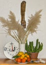 Vintage hours, a cane bouquet, a cactus, an amulet, fruit and a