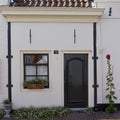 Vintage house facades with window door and flowers Naarden Netherland