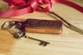 Vintage house keys and wood home keychain on wooden table background, key concept Royalty Free Stock Photo