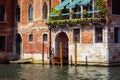 Vintage house, Venice, Italy. Entrance to residential house or hotel by Grand Canal, famous street of Venice