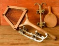 Vintage ice skates and tennis racket on wooden background. Retro ice skates and tennis racket. Royalty Free Stock Photo