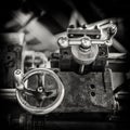 Vintage image of the adjustment knobs of an antique parallel lathe for turning mechanical parts, black and white, tool carriage Royalty Free Stock Photo