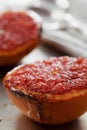 Vintage image of broiled grapefruit with brown sugar and cinnamon on metal surface, healthy dessert is good for breakfast