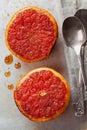 Vintage image of broiled grapefruit with brown sugar and cinnamon on metal surface, healthy dessert is good for breakfast