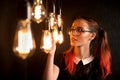 Old fashioned scholgirl with incandescent Edison type bulbs