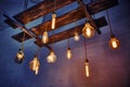 Vintage incandescent lamps mounted on a wooden ceiling structure. Christmas festive decoration