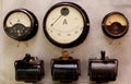 Vintage industrial board with an analogue dial switch and electrical symbols