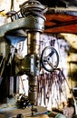 Vintage industrial machine in a garage, displaying its intricate metallic components