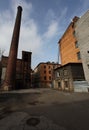 Vintage industrial red brick building in the industrial area of the old European city. Royalty Free Stock Photo