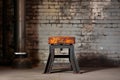 vintage industrial stool in front of an exposed steel beam