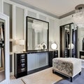 A vintage-inspired dressing room with a vanity table, a full-length mirror, and a walk-in closet with organized storage for clot Royalty Free Stock Photo