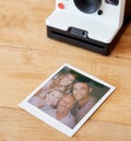 Vintage Instant Film Camera With Print Of Senior Parents And Adult Offspring Posing For Selfie