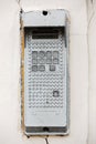 Old vintage intercom doorbell on apartment building doors