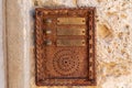 vintage intercom on weathered stone wall