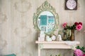 Vintage interior with mirror and a table with a vase and flovers Royalty Free Stock Photo