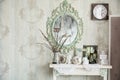 Vintage interior with mirror and a table with a vase and willows Royalty Free Stock Photo