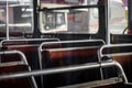 Vintage interior of an old abandoned school bus with red seats Royalty Free Stock Photo