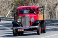 Vintage International Flat bed truck driving on country road