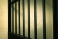 vintage iron jail door in prison building with copy space in cinematic tone