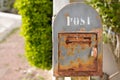 Vintage iron rusty post box on home wall old mailbox Royalty Free Stock Photo