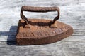 Vintage rusty iron on a wooden table. Retro style Royalty Free Stock Photo