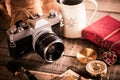 Vintage items, pen red book, coins money, compass and retro photo film camera on wood background Royalty Free Stock Photo