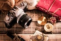 Vintage items, pen red book, coins money, compass and retro photo film camera on wood background Royalty Free Stock Photo