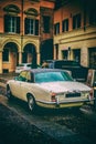 vintage jaguar car in vertical colorful vignette antique background