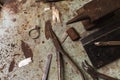 Vintage jeweler`s desk with various tools and gold ring, top view